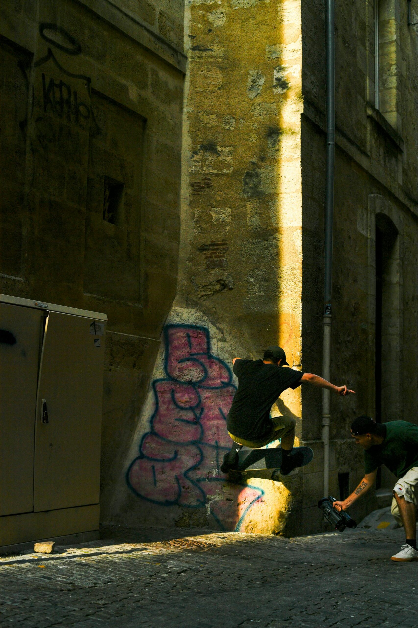 Long angle. Sunlight in 7 pm into a narrow street.